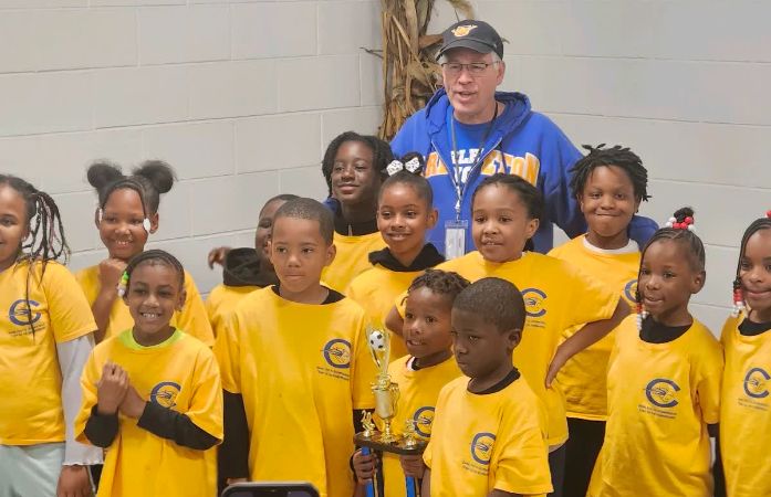  Carleton Cougars all smiles with Mr. Drake their couch.